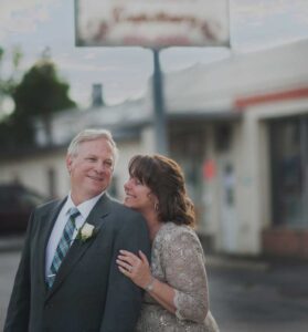 Man and woman leaning together.