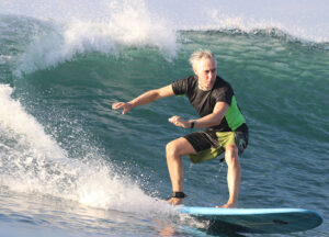 mike downey rides a wave